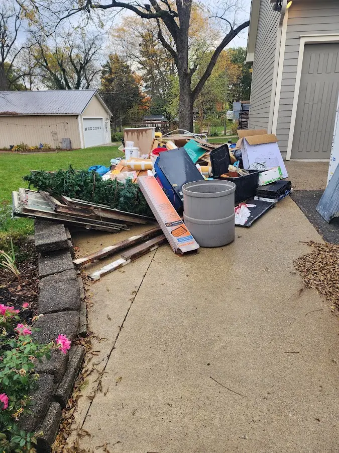 Dumpster being loaded with debris for Roofing Dumpster Rental in Avenal